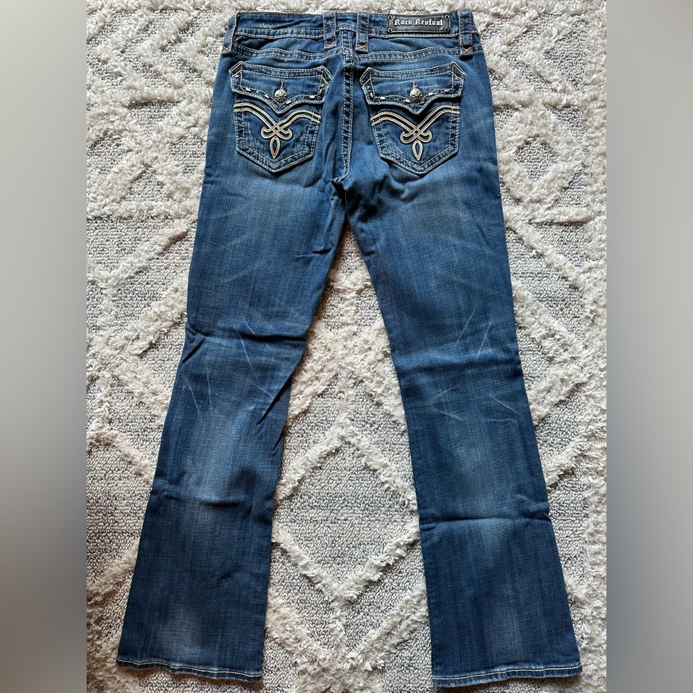 Rock Revival Bootcut Jeans with beautiful leather design back pockets.